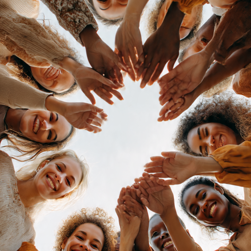 women_from_diverse_backgrounds_joining_hands_or (3)